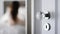 Open door into room, defocused view of woman in a bedroom interior, home decor and lifestyle