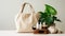 Open eco-friendly cotton reusable bag with different containers from natural wood and brown glass.Fresh natural leafs around.