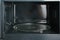 Open empty microwave oven, closeup.