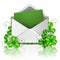 Open envelope with green paper and leaf clover for St. Patrick`s Day