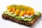 open faced avocado sandwich with white background