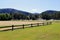 Open fields with sprinkler system, mountain range beyond.