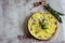 Open fish pie on a wooden platter on a gray background. Fish pie on an old background. Tart with fish