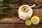 Open fresh coconut and citrus fruits on wooden table