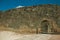 Open gate on a stone outer wall