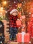 Open gift. Lovely baby enjoy christmas. Santa boy little child celebrate christmas at home. Childhood memories. Boy cute