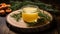 Open glass jar of cream honey stands on stand made of natural wood. There are sprigs of rosemary nearby. Composition on background