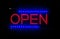 Open glowing sign at night