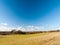 Open grass land farm agriculture plain blue sky above Wivenhoe