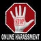 Open hand with the text stop online harassment. Global social problem