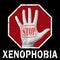 Open hand with the text stop xenophobia. Global social problem