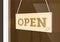 Open hanging sign with smiley facer