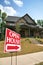 Open house sign in front of a home