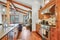 Open kitchen design with vaulted ceiling and hardwood floor.