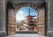 Open large wooden door with Chureito Pagoda and Mount Fuji in Autumn