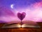 Open magic book of life, knowledge, wisdom. Fantasy, nature or learning concept with heart shaped tree