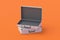 Open metal suitcases for lot of money or documents on orange background