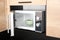 Open modern microwave oven with dish