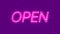 Open neon sign appear on violet background.
