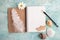 Open notebook, pencil, sea shells, wooden boat