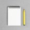 Open notepad on trendy yellow background