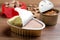 Open package of wet pet food on wooden table, closeup