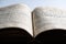 Open page of Torah. Closeup of old jewish holy book. Selective focus