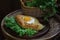 Open pie with an egg submitted on leaves of green salad