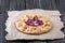 Open pie Galette with red gooseberry