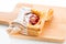 Open pies of puff pastry pies with cranberries, apples and honey.