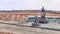 Open pit coal mine with huge backhoe digger