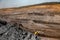 Open pit mine industry panoramic photo of workflow car