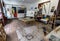 Open plan artists studio with easel, watercolours and hanging paintings in Funchal on Madeira. Portugal