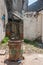 Open plot between houses with trashcan in Hutong  dowtown Tongli, China