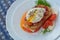 Open poached egg, sausage, tomato, feta cheese, dill, bread - fast snack