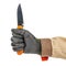 Open pocket folding knife with bright orange handle clenched in a worker fist in black protective glove isolated on white