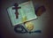 Open prayer book and Church Slavonic text evening prayer, crucifix and other symbols of Orthodox Christian faith