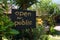 Open for public sign post with statue of buddha, Ubud in Indonesia