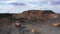 Open Quarry with heavy duty machinery aerial view.