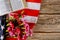 Open reading Bible on a closeup of Carnation of cut flowers in the American flag