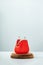 Open Red Coin Purse on wooden podium on blue background