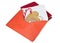 Open red envelope with gingerbread, candy and a gold heart inside .