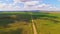 Open road crossing a wide prairie valley