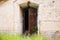 Open rusted door in old wall, background texture