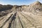 Open sand pit, for sand extraction during construction. The texture of sand and traces of the tread of large cars. Sand for
