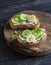 Open sandwich with goat\'s cheese and cucumber and boiled quail eggs