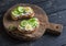 Open sandwich with goat\'s cheese and cucumber and boiled quail eggs