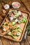 Open sandwich with salmon and herring, cream cheese and salad on a cutting board. wooden background. Top view