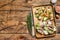 Open sandwich with salmon and herring, cream cheese and salad on a cutting board. wooden background. Top view. Copy