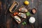 Open sandwiches with toast bread ricotta and fish sardines, on old dark  wooden table background, top view flat lay